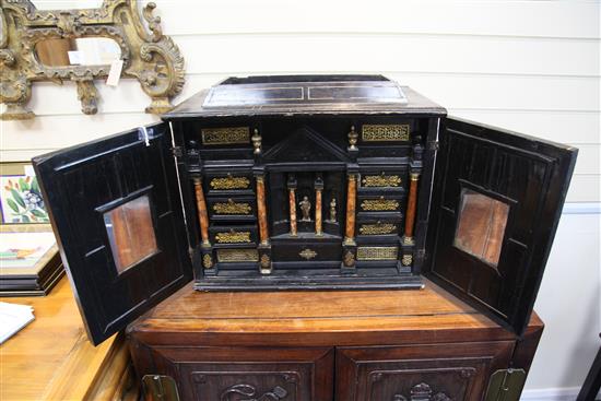 A 19th century Flemish ebonised table cabinet, 21in.